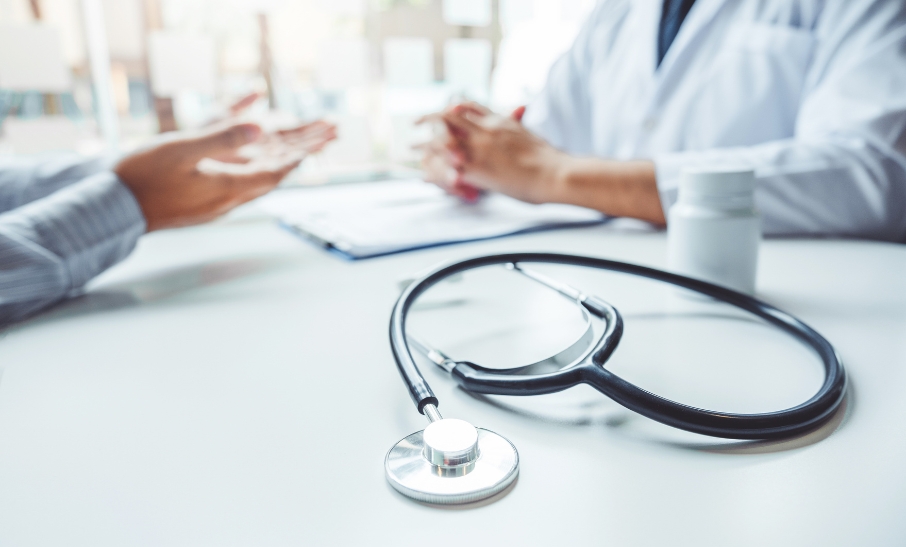 Doctor with a stethoscope advising a patient in a Swiss practice